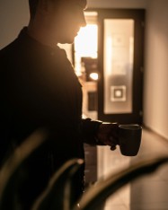 A professional pausing with a warm drink after work